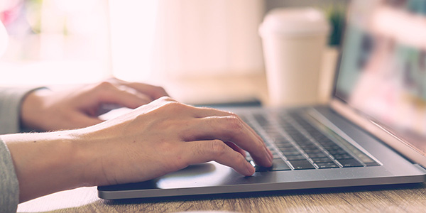 Individual working on a laptop